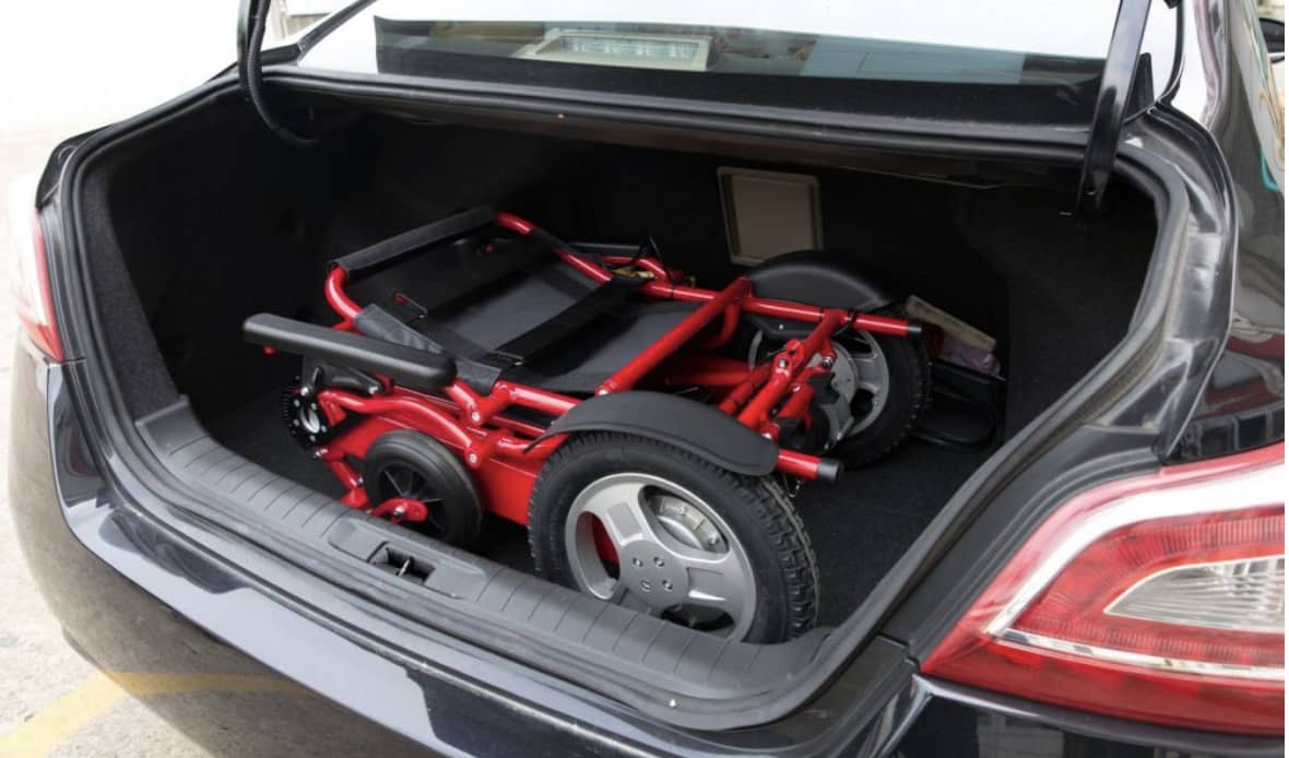 Folded electric wheelchair in boot of car_bettercaremarket