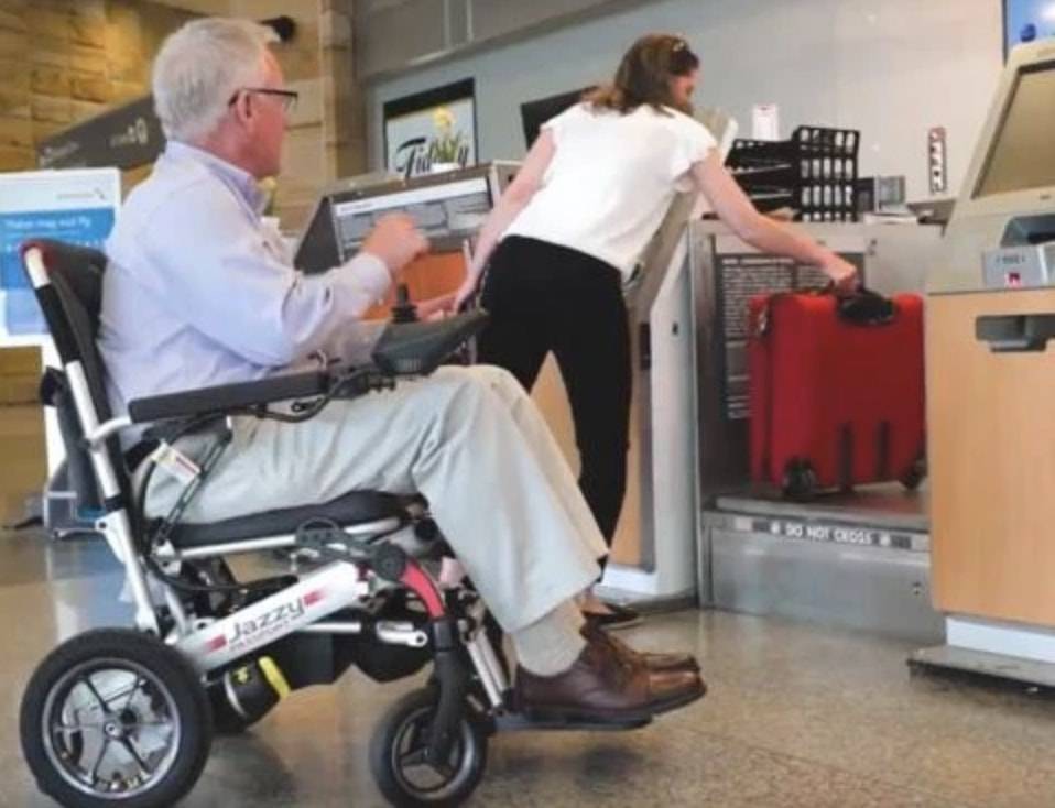 Man in electric wheelchair at airport_bettercaremarket