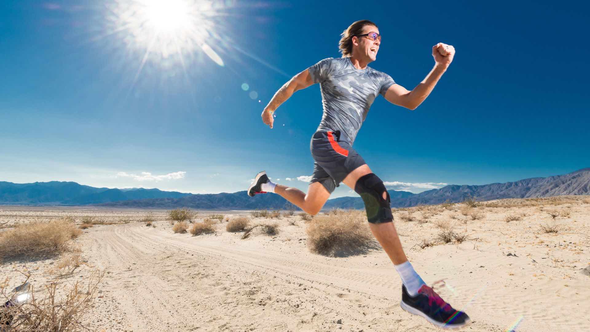 Man running with knee brace